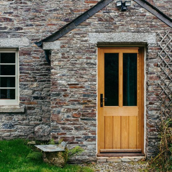 custom timber door on cottage porch
