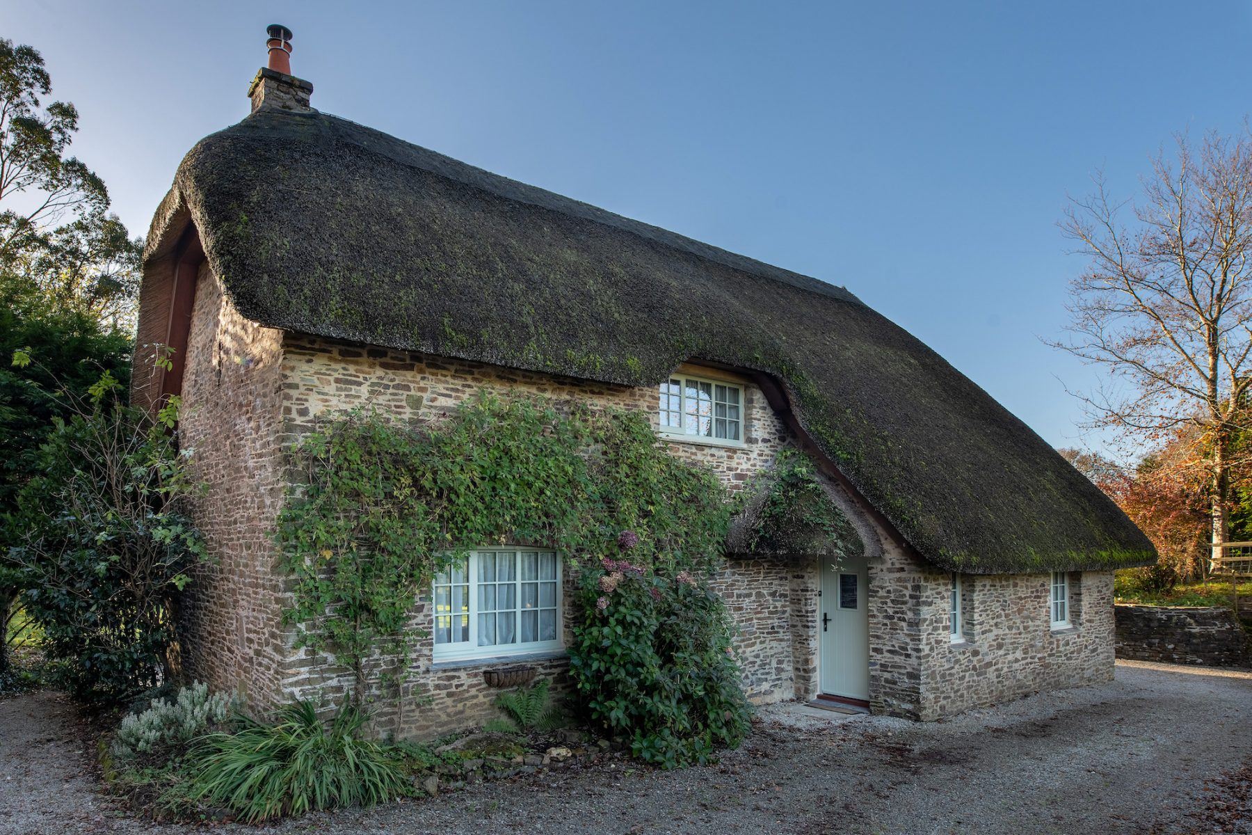National Park timber windows full view thatched cottage