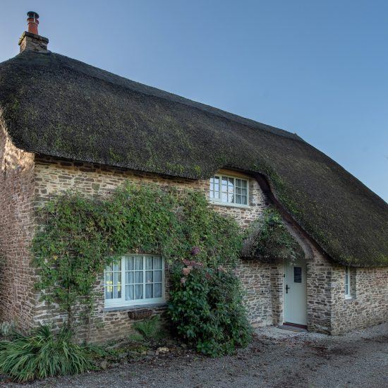 National Park timber windows full view thatched cottage
