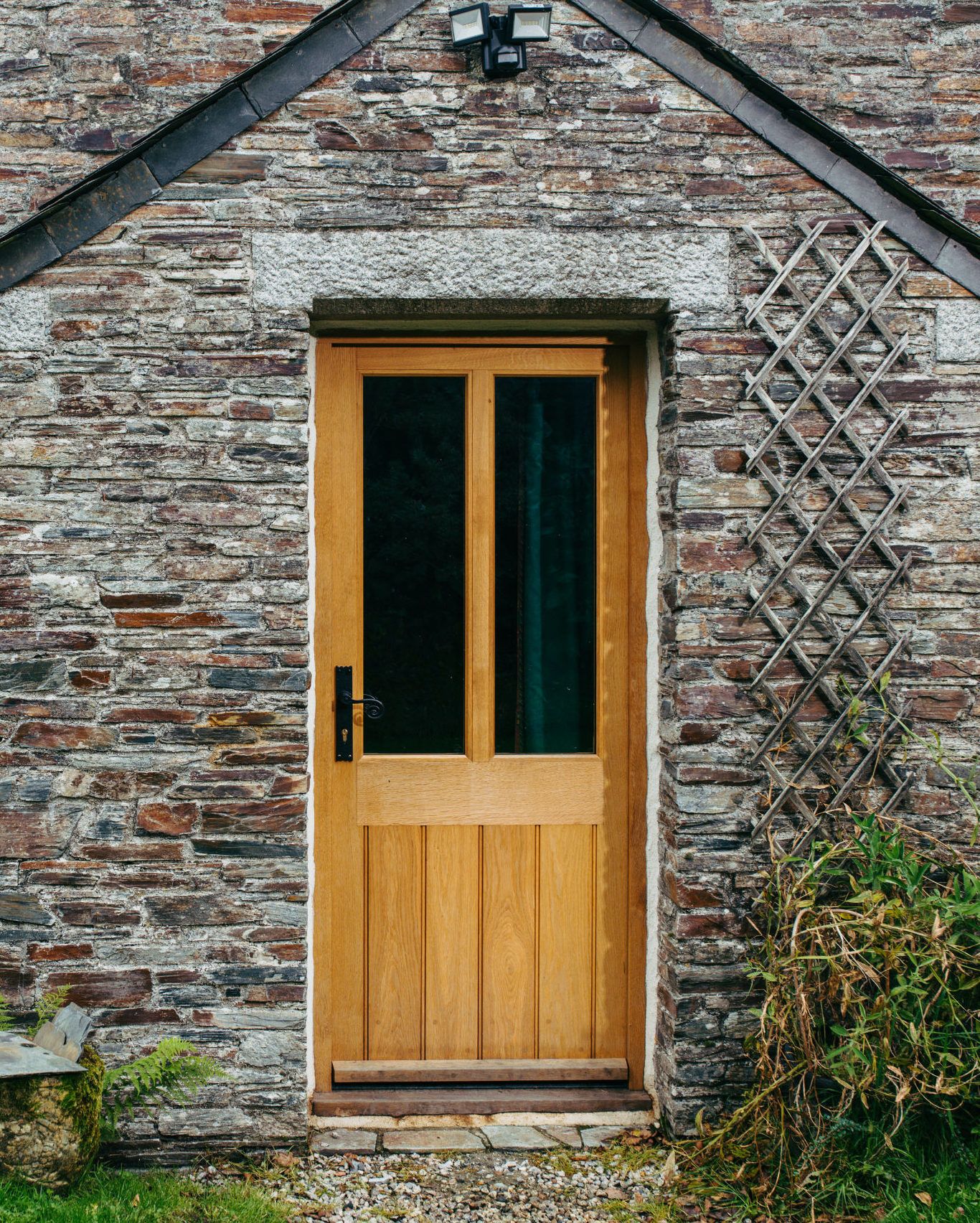wooden front door with glass